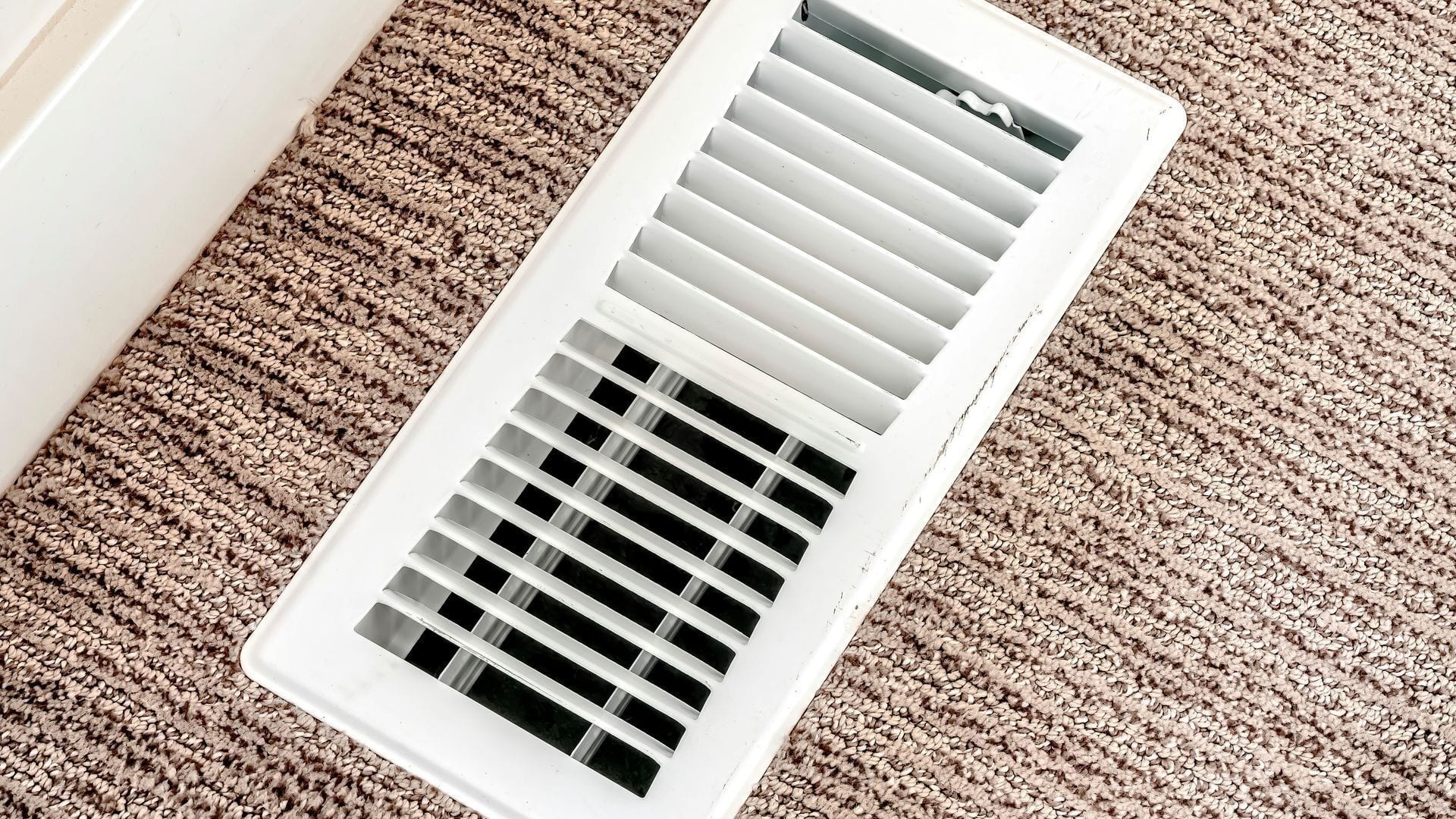 Floor air vent on carpet in a Tyler, TX home